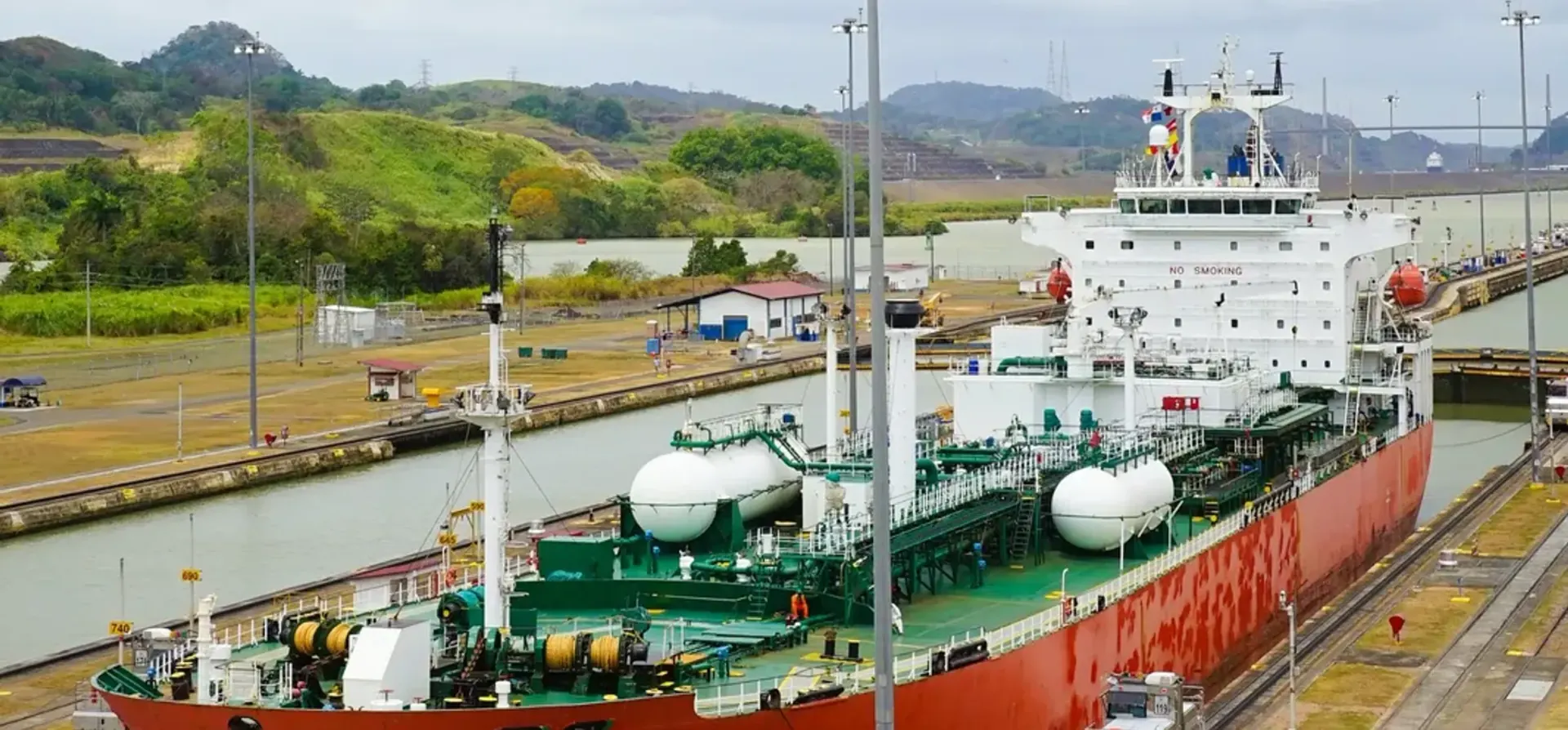 Product tanker transiting a canal lock