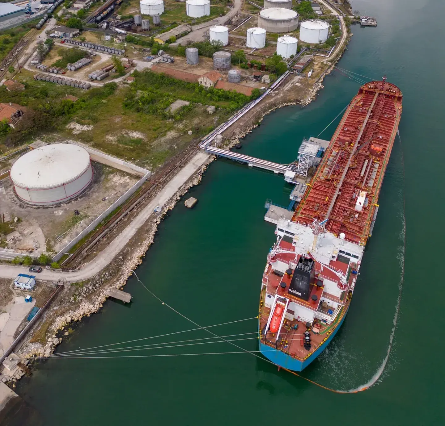 Tanker discharging at a tank-farm terminal