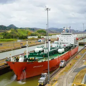 Product tanker transiting a canal lock
